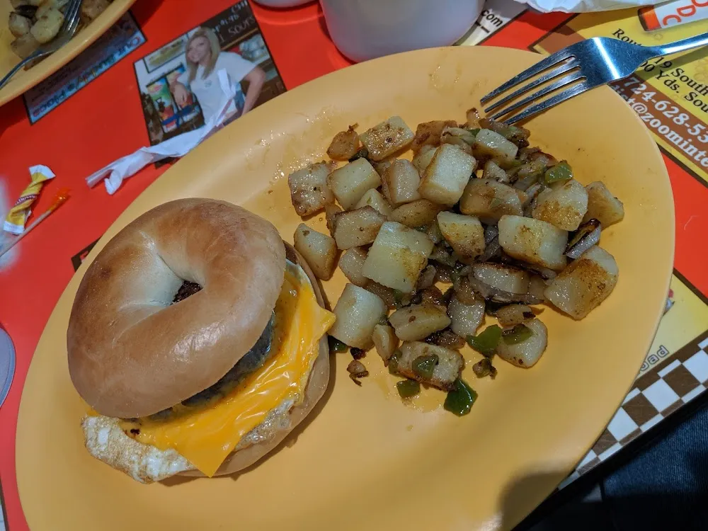 Sausage Egg Cheese on Bagel with Home Fries